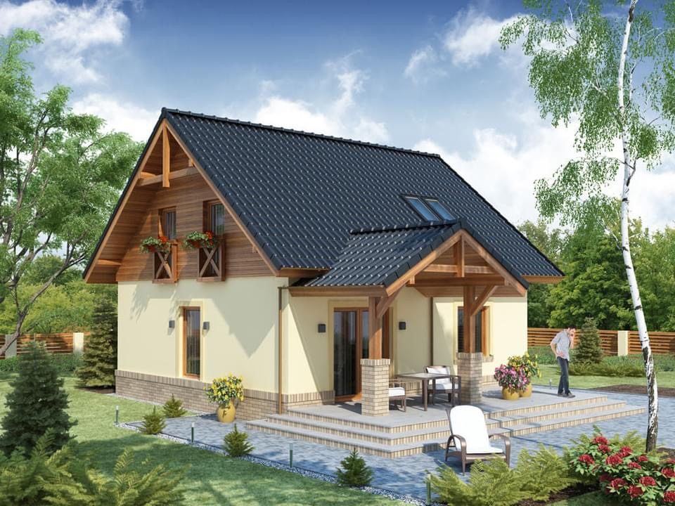 A modern two-story house with a sloped roof, surrounded by greenery and a patio.