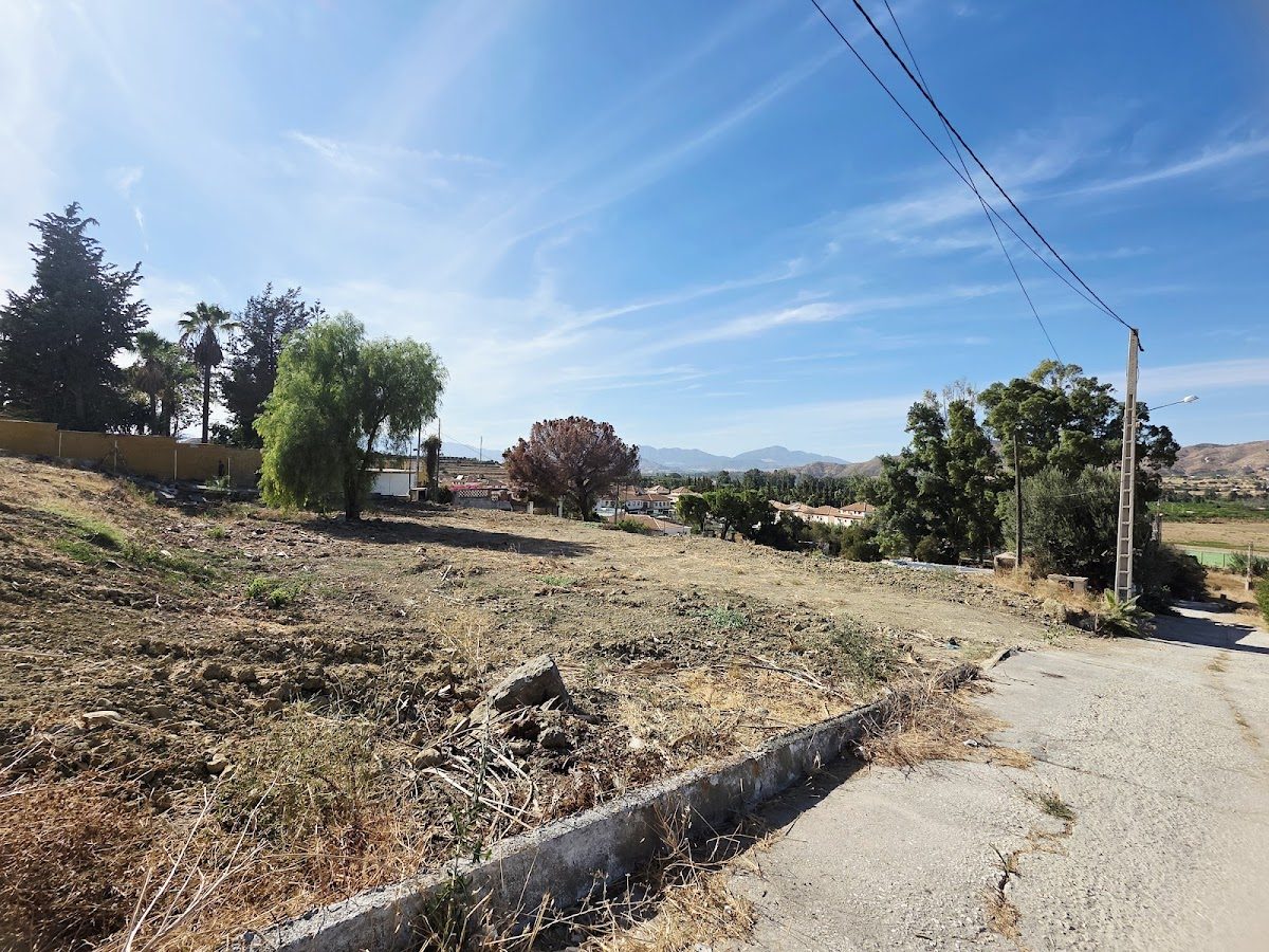 Vacant land with trees and mountain views, located near C. Aragón in Cártama, Málaga.