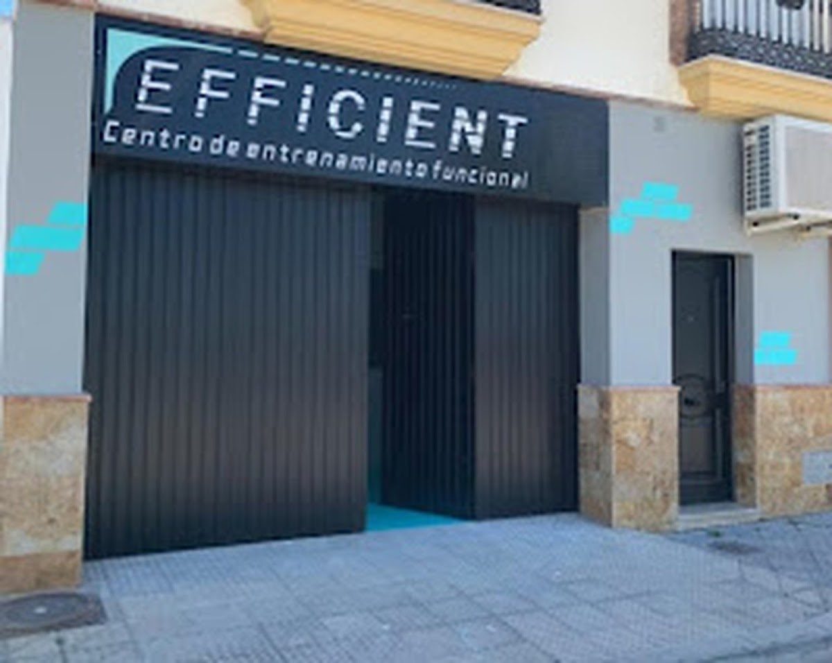 Exterior view of Efficient, a functional training center with a modern black façade and blue accents.