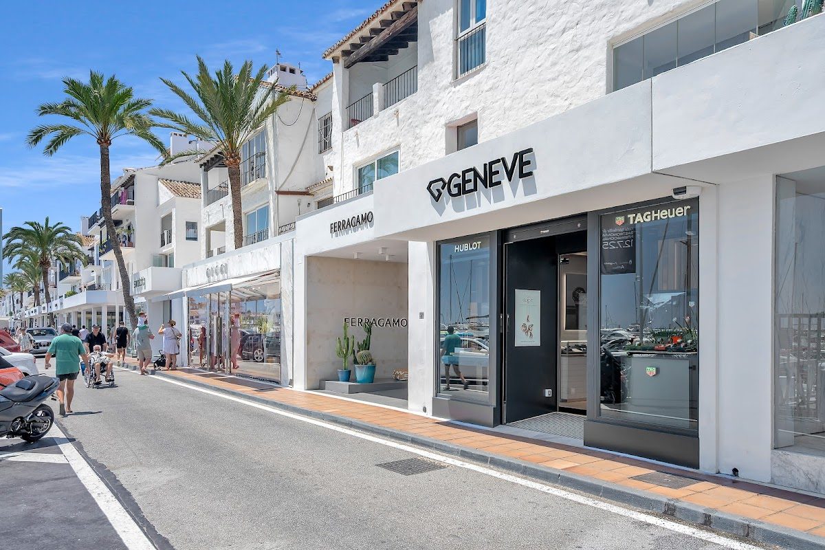 GENEVE 1989 storefront featuring luxury watches and jewelry, located along a palm-lined street in Marbella.