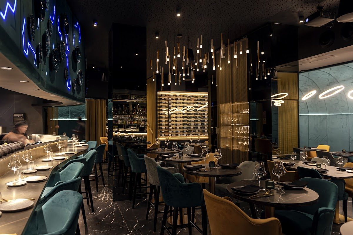 Elegant interior of Oculto l Restaurant in Nerja, featuring modern decor, stylish seating, and ambient lighting.