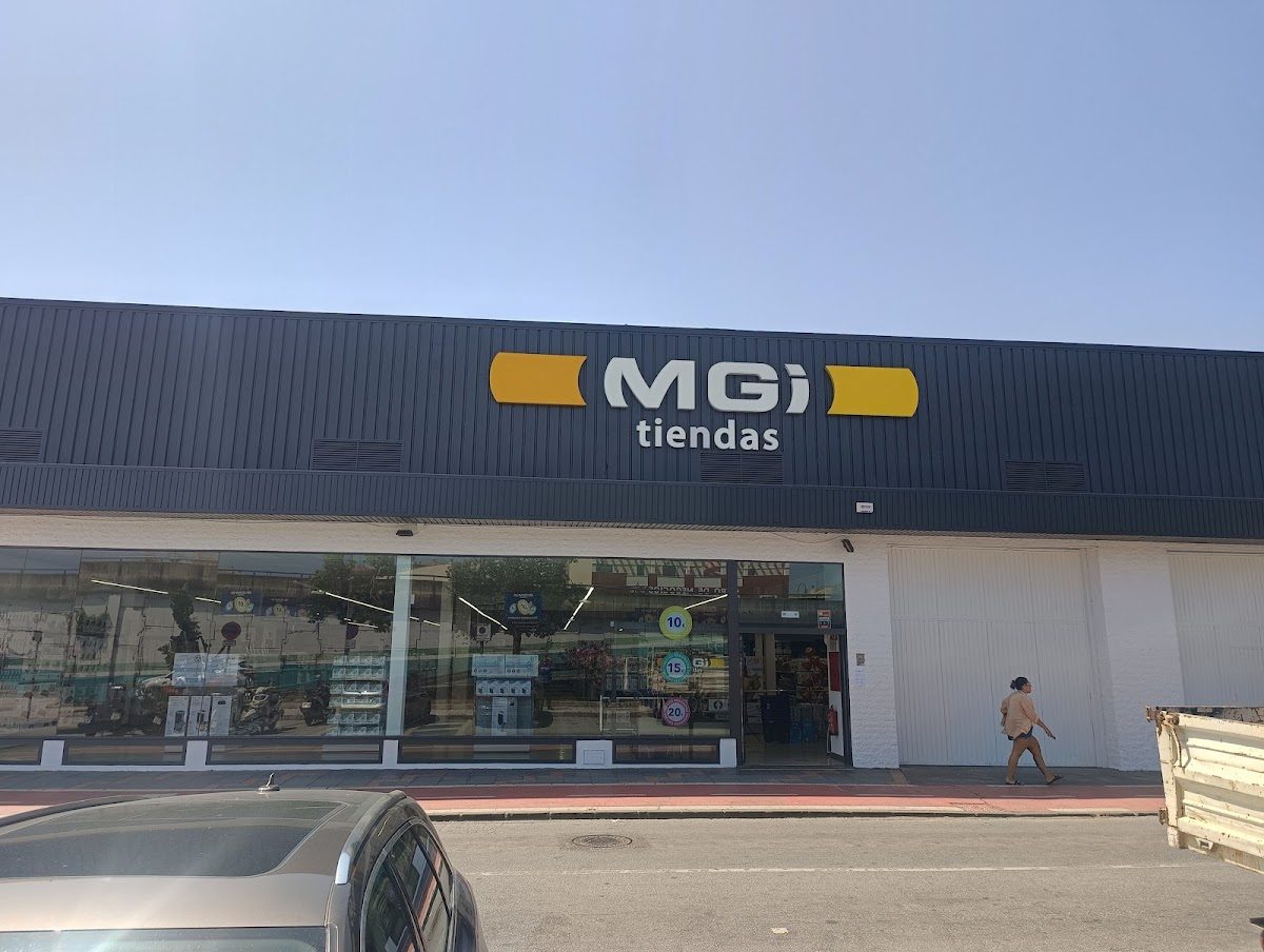 Tiendas MGI Mijas features a modern storefront with large glass windows and a prominent sign.