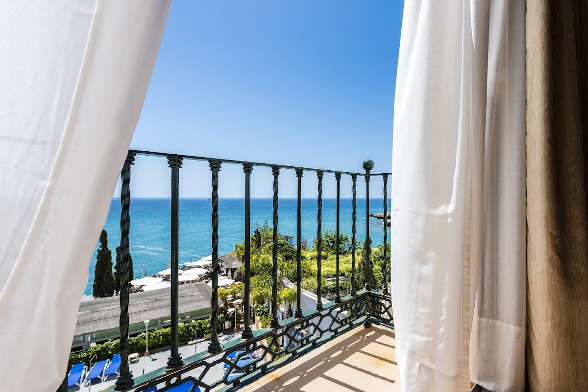 View from a balcony at Toboso apar-turis, overlooking the sea and coastline in Nerja.