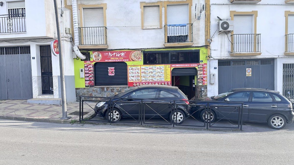 UZTURK KEBAB COIN features a colorful exterior with signage and menu displays visible from the street.
