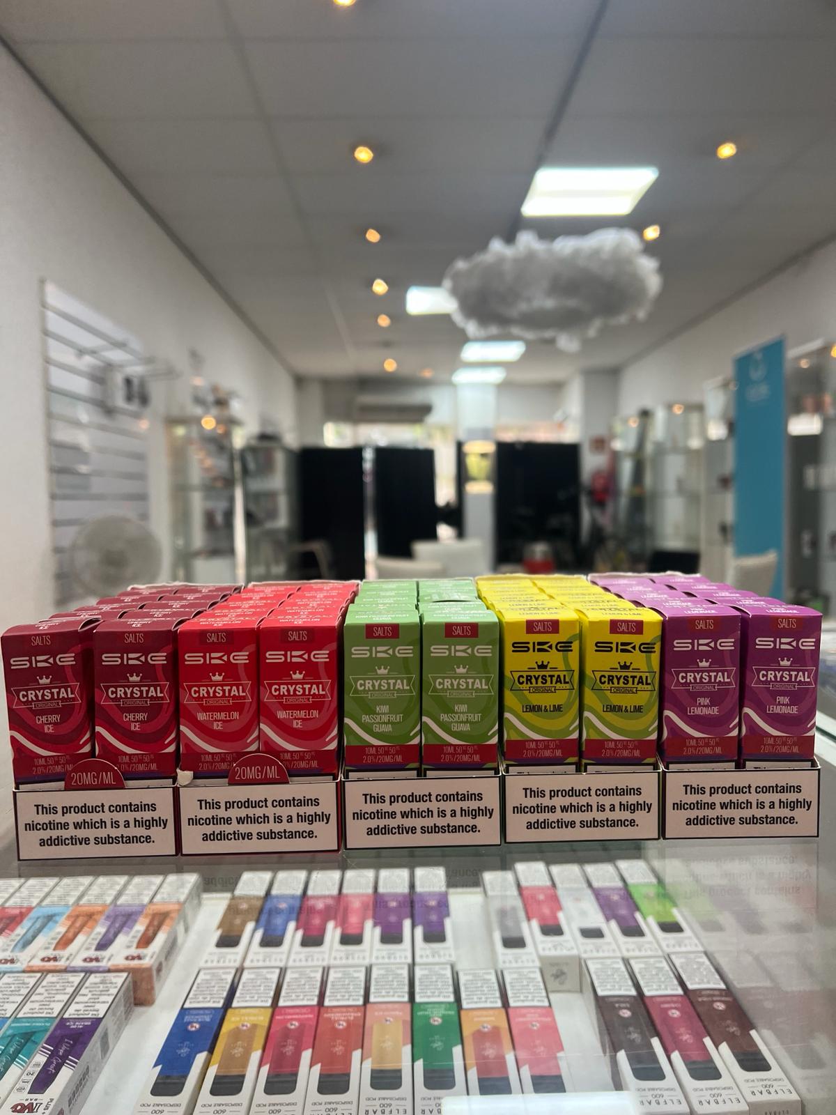 Display of colorful vape products arranged neatly on a counter at Vape Store Malaga.
