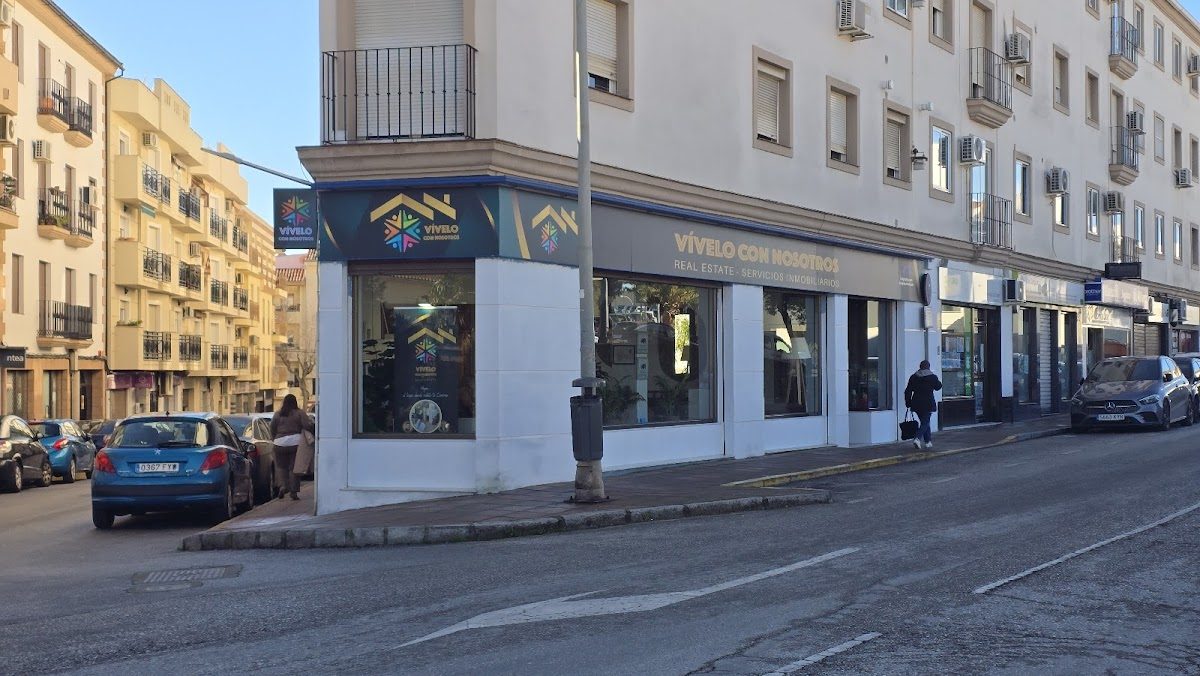 Vívelo Con Nosotros features a modern exterior with large windows on Avenida Victoria in Ronda.